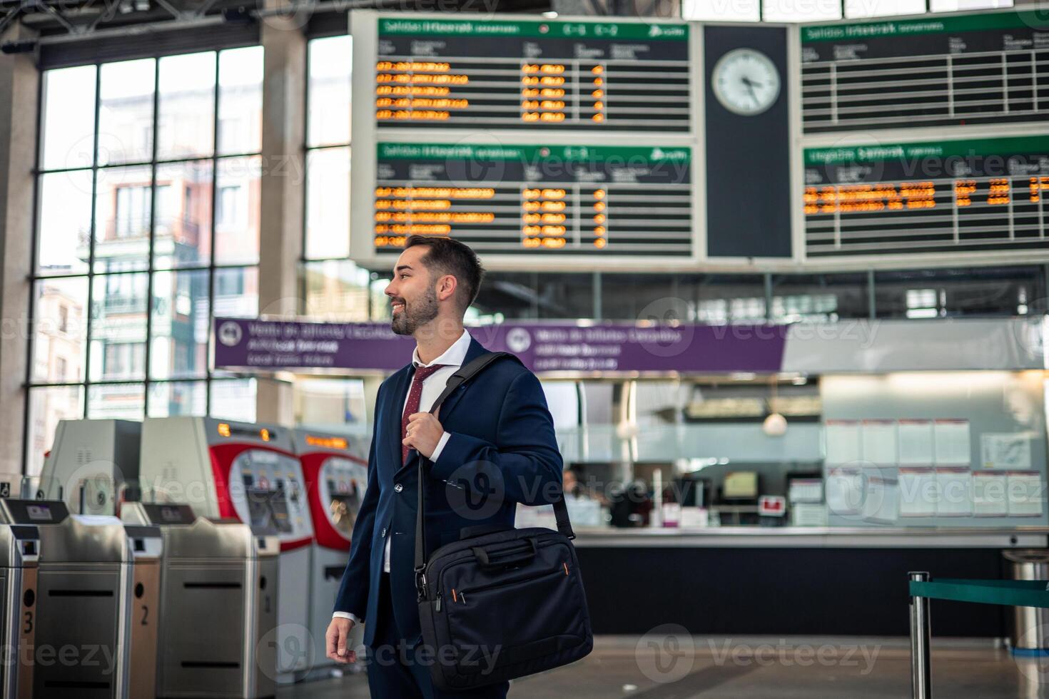 copyspace businessman with briefcase walking toward the train platform, ready for his workday photo