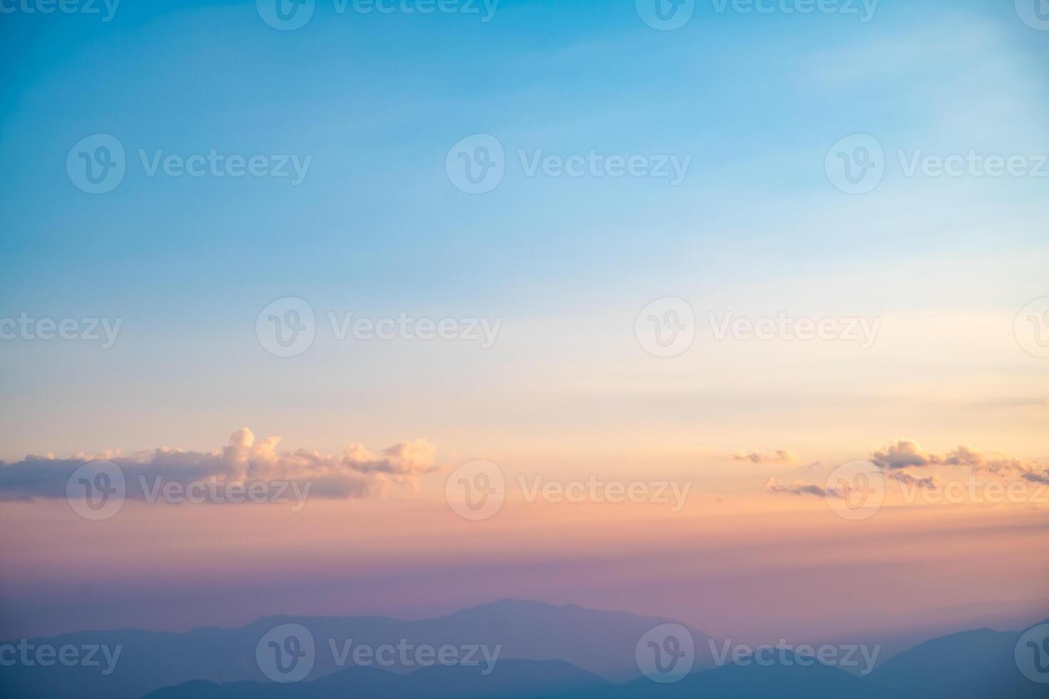 Beautiful clouds at sunset over mountains, rays of sunshine, beautiful light, natural background, calm and tranquility photo