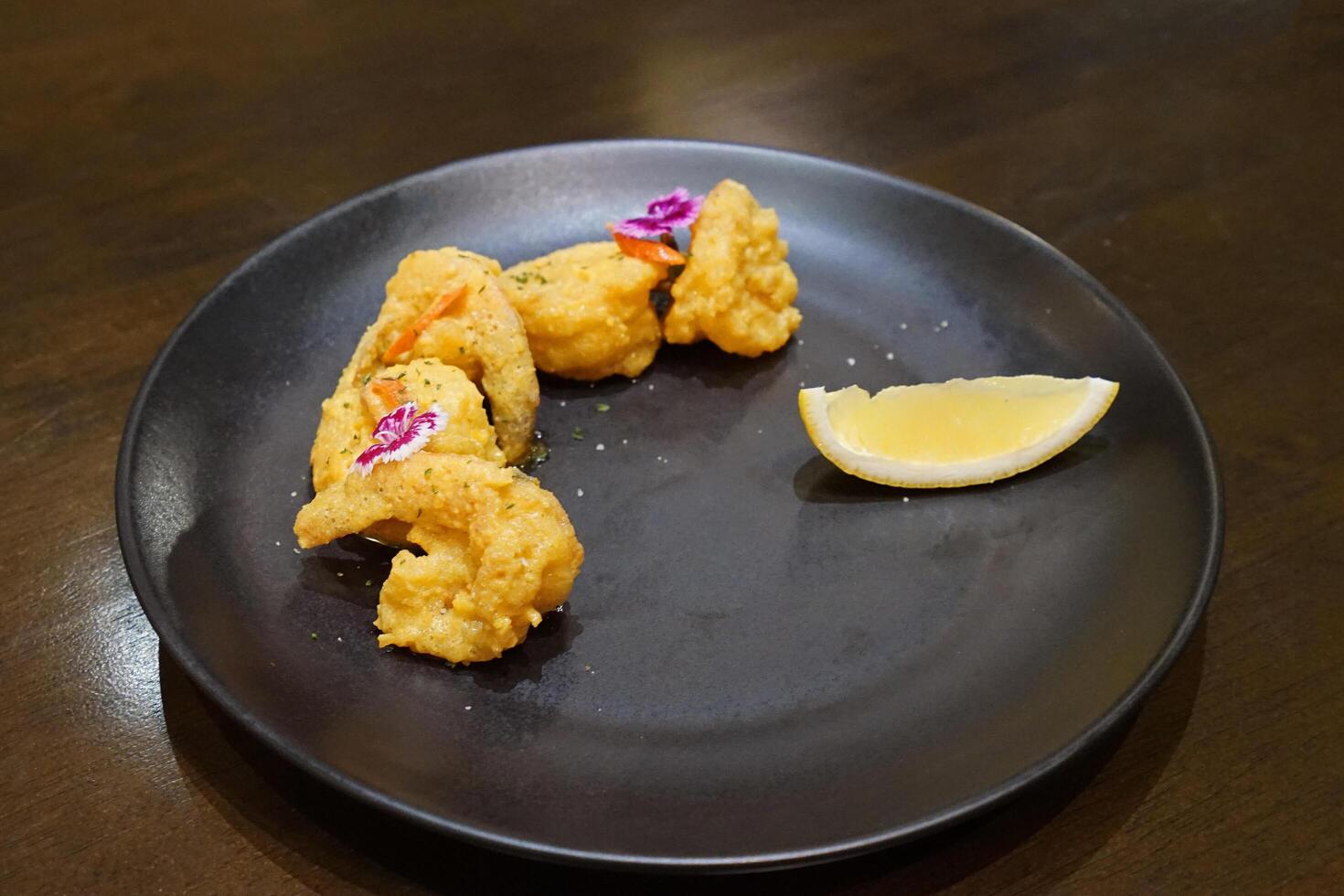Close up battered and deep fried small shrimp photo