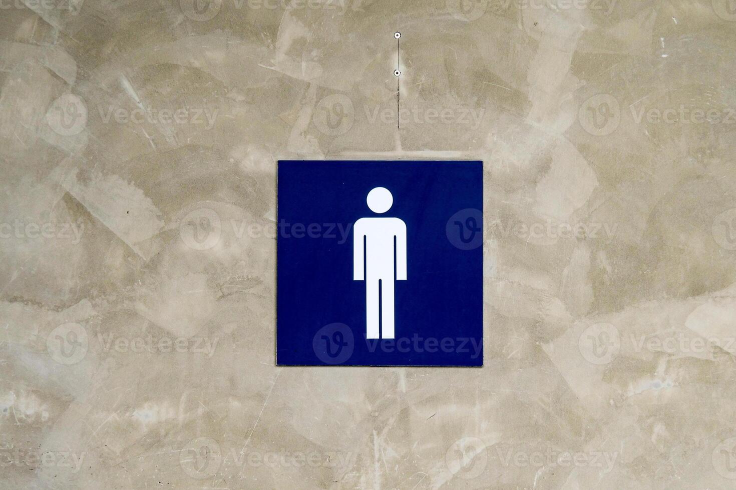 Minimalist Restroom Sign on Textured Wall in Modern Public Space photo