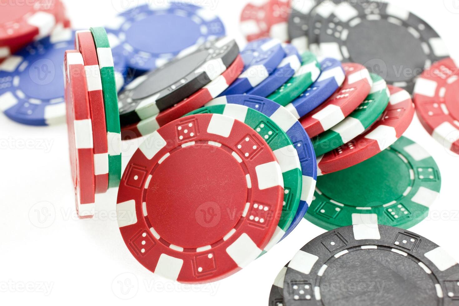 multicolor poker chips heap isolated photo