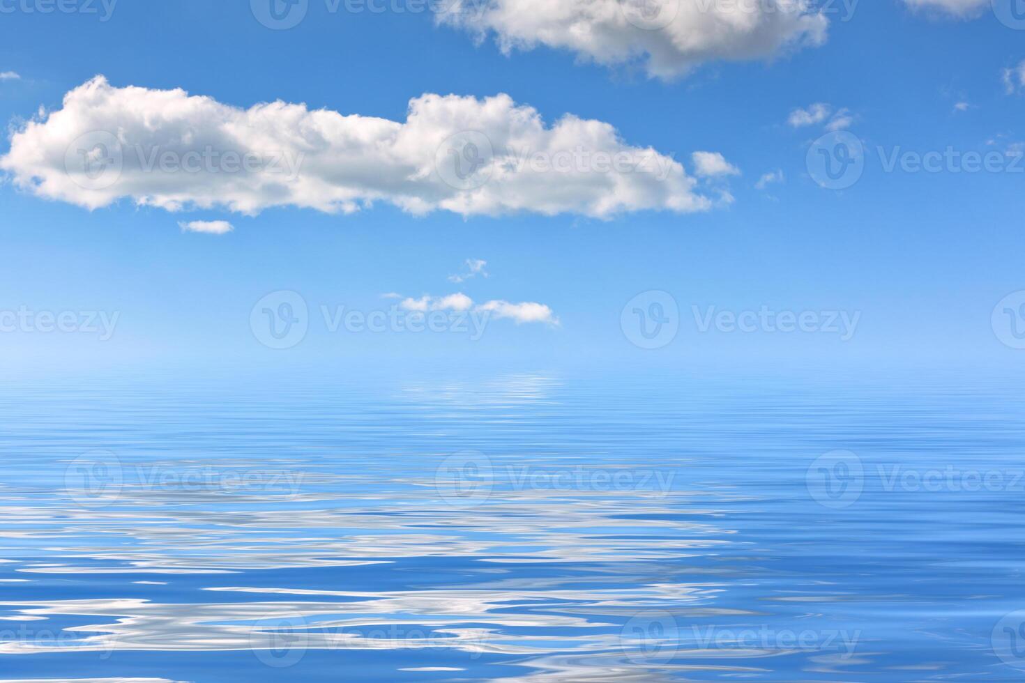 Water background with reflections of bright sky photo