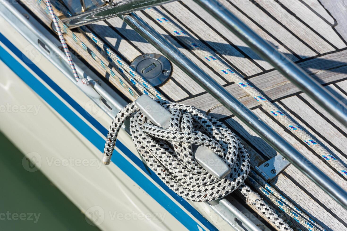 Mooring rope tied around a cleat photo