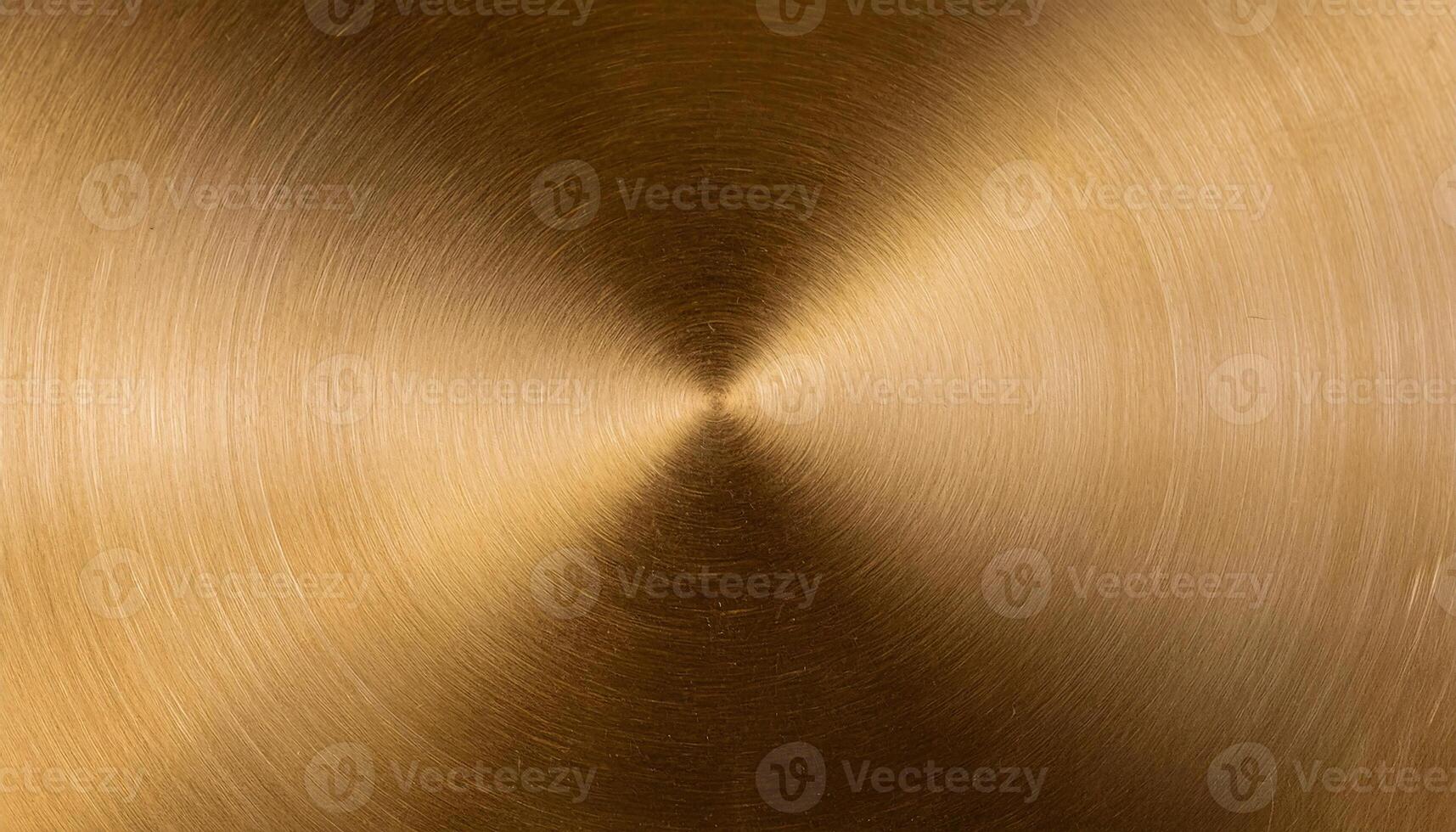 macro view of a polished brass plate with concentric circular brushed texture and rich golden metallic tones photo
