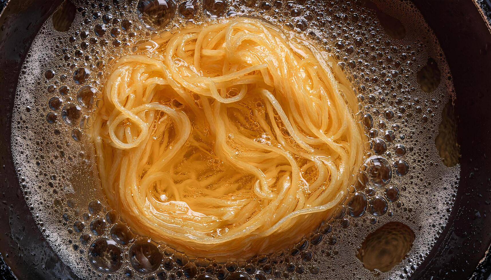 top view of egg noodles frying in hot bubbling oil with crispy golden textures and intricate details photo