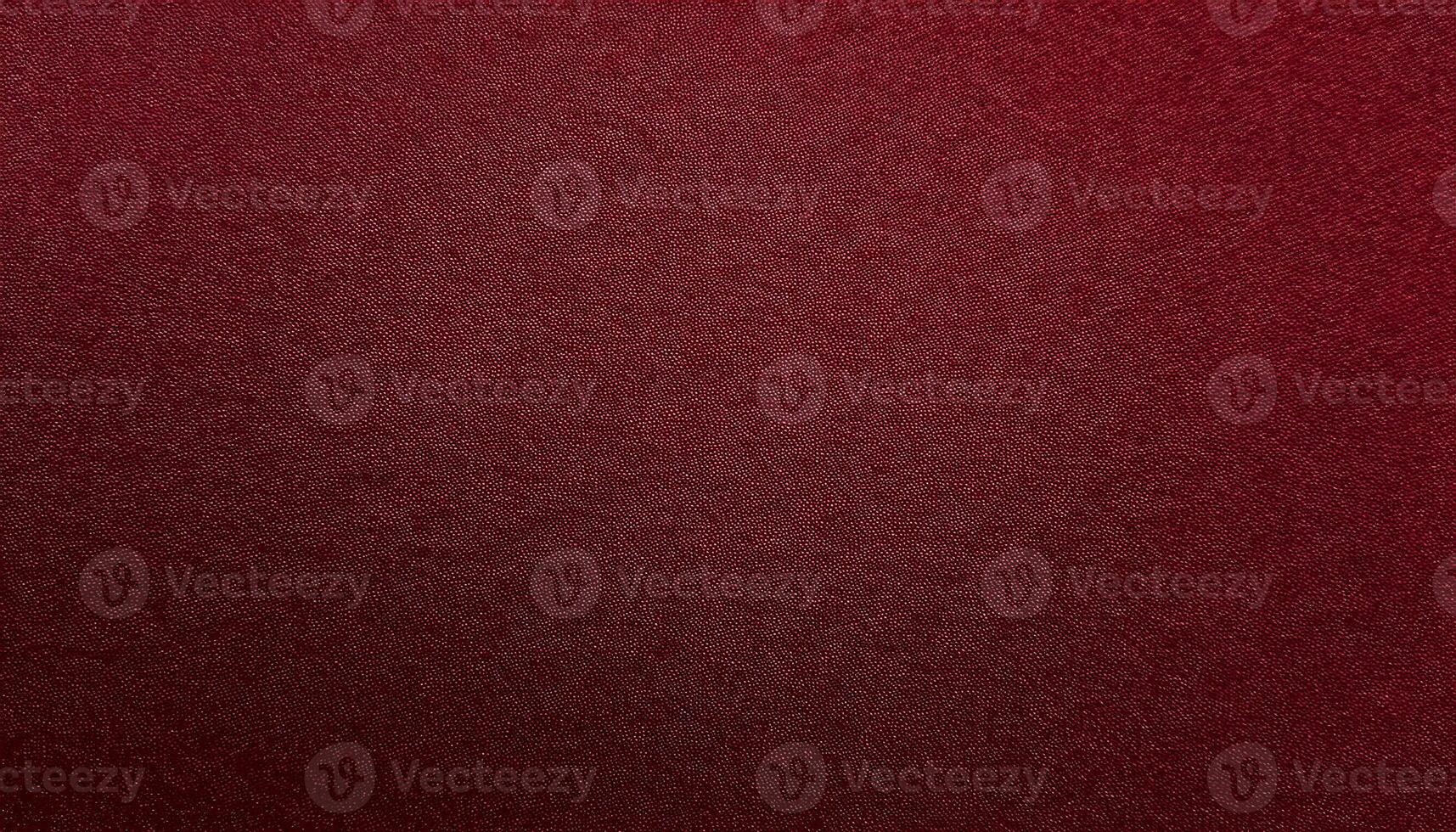 close-up of deep red velvet-finished paper with fine texture and smooth tactile surface photo