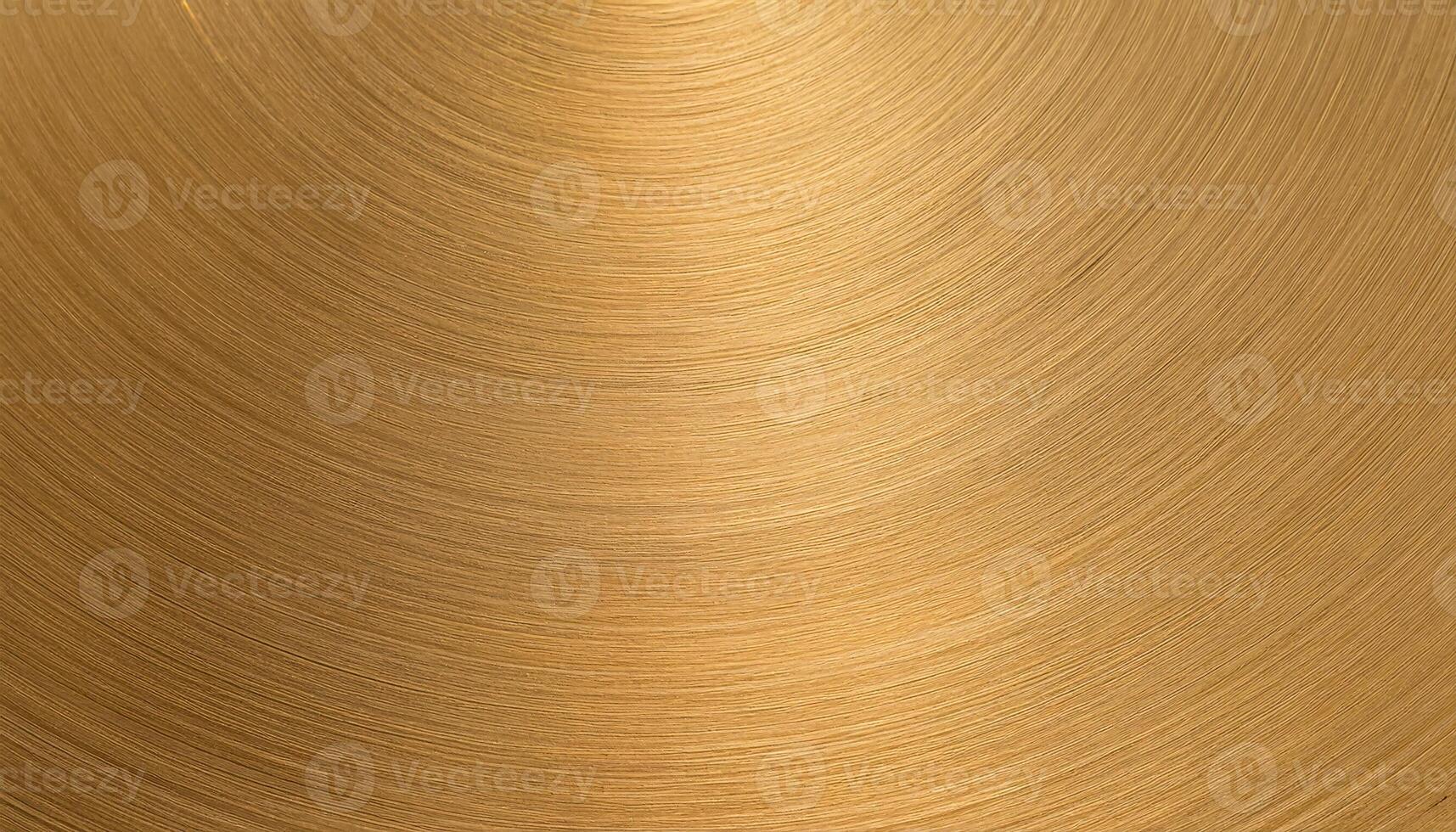 macro view of a clean brass plate with smooth concentric brushed texture and warm golden metallic tones photo