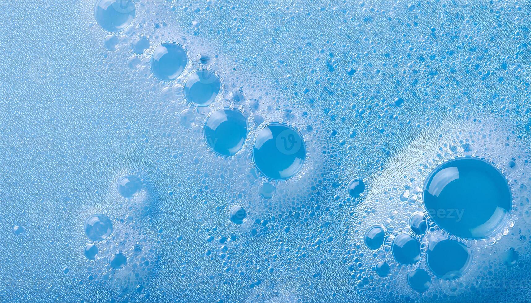 macro view of delicate blue cleanser foam with evenly sized micro-bubbles and smooth texture photo