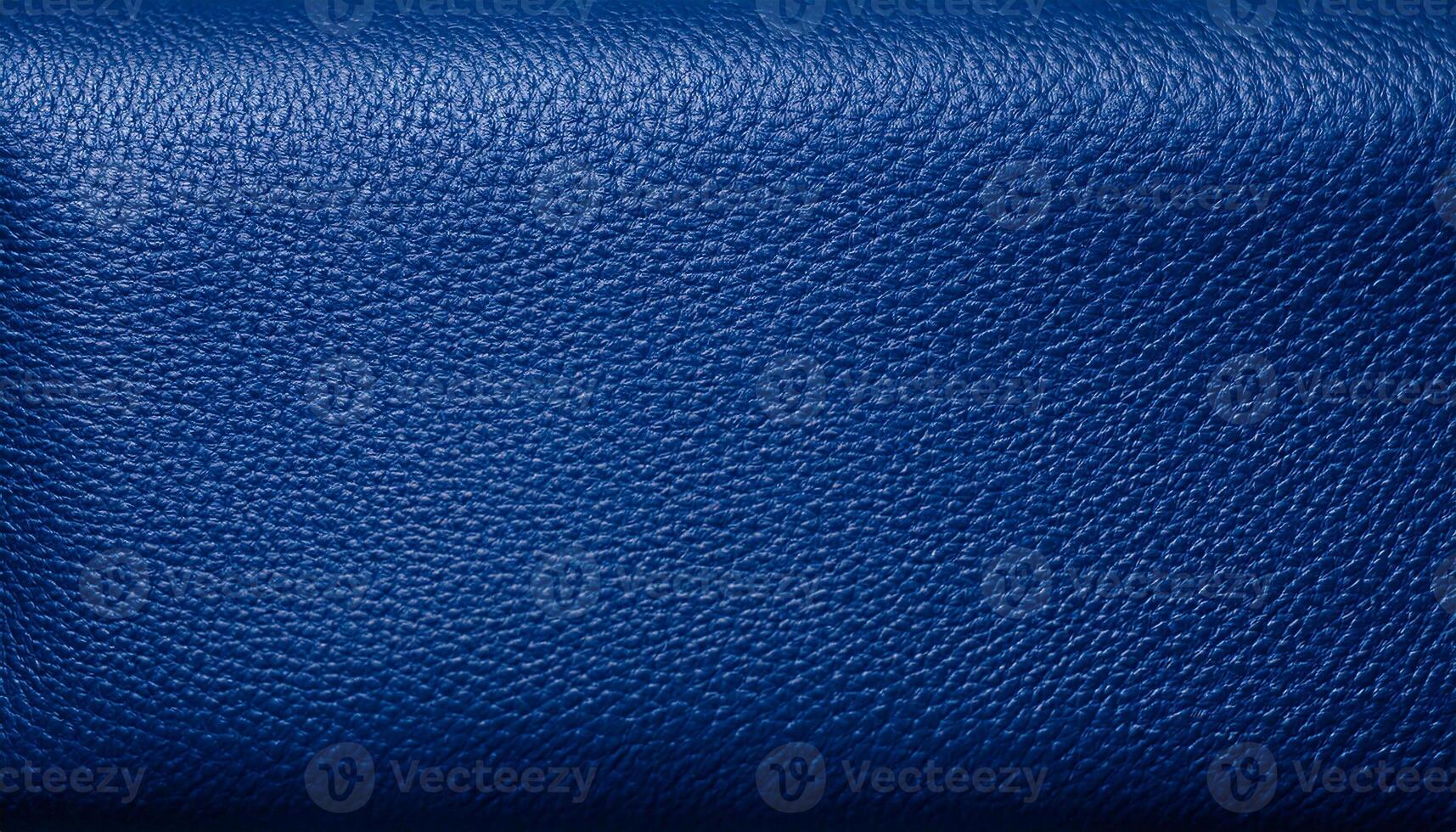 macro view of navy-blue leather with fine grain texture, ideal for luxury products and upholstery photo