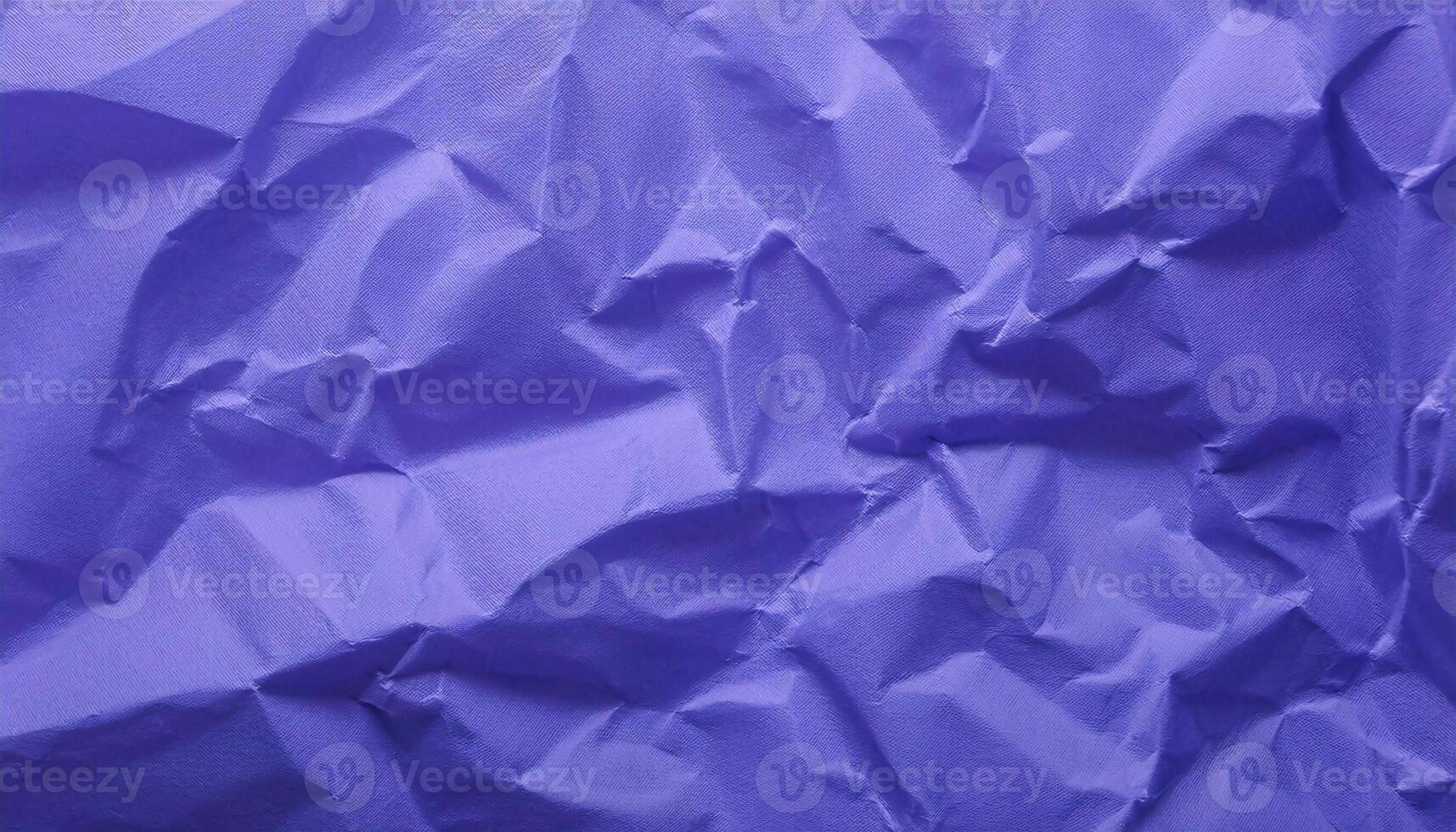 close-up of crumpled violet paper texture with intricate folds and wrinkles for creative backgrounds photo