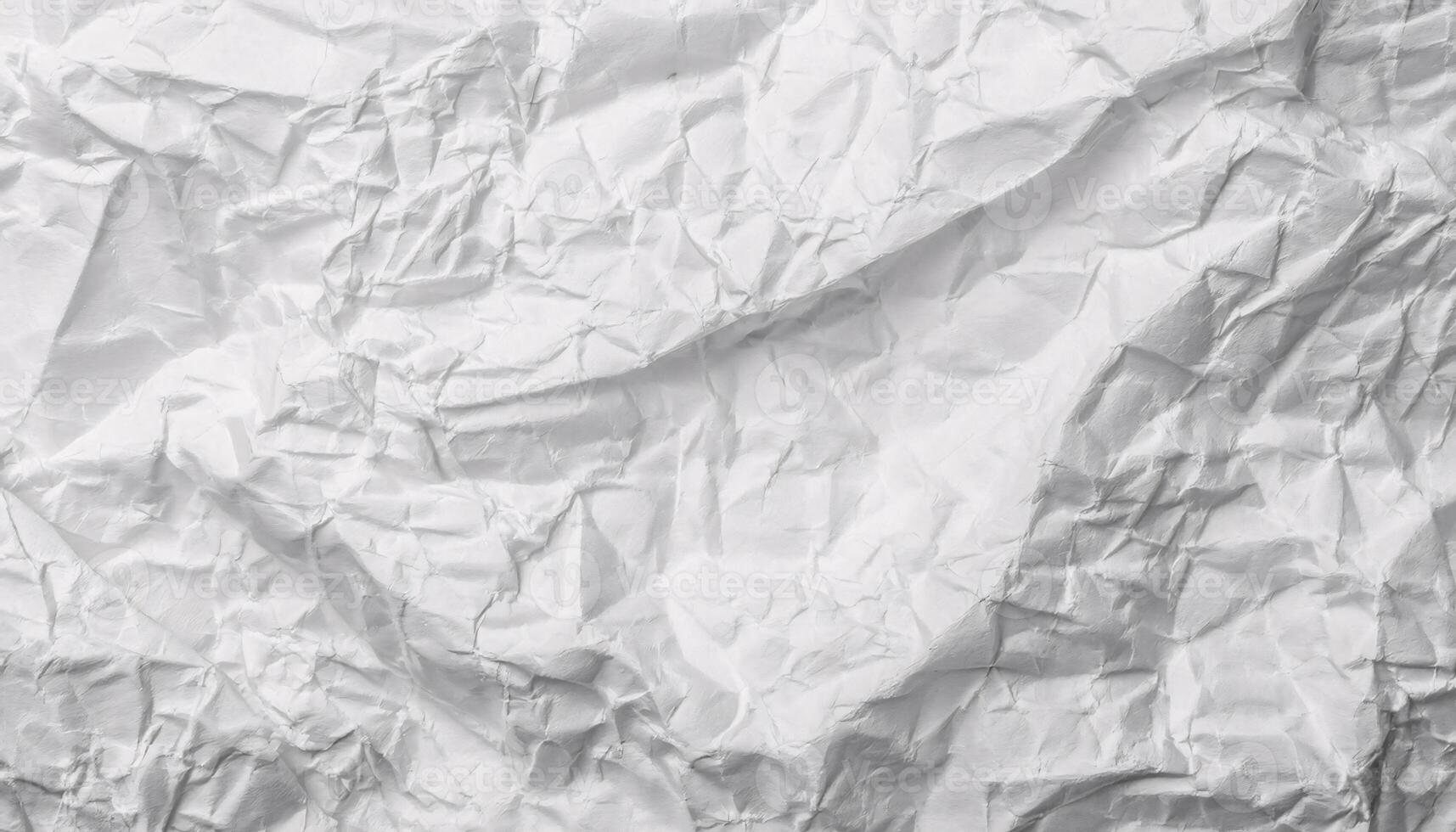 close-up of crumpled white paper texture with intricate folds and wrinkles for creative backgrounds photo