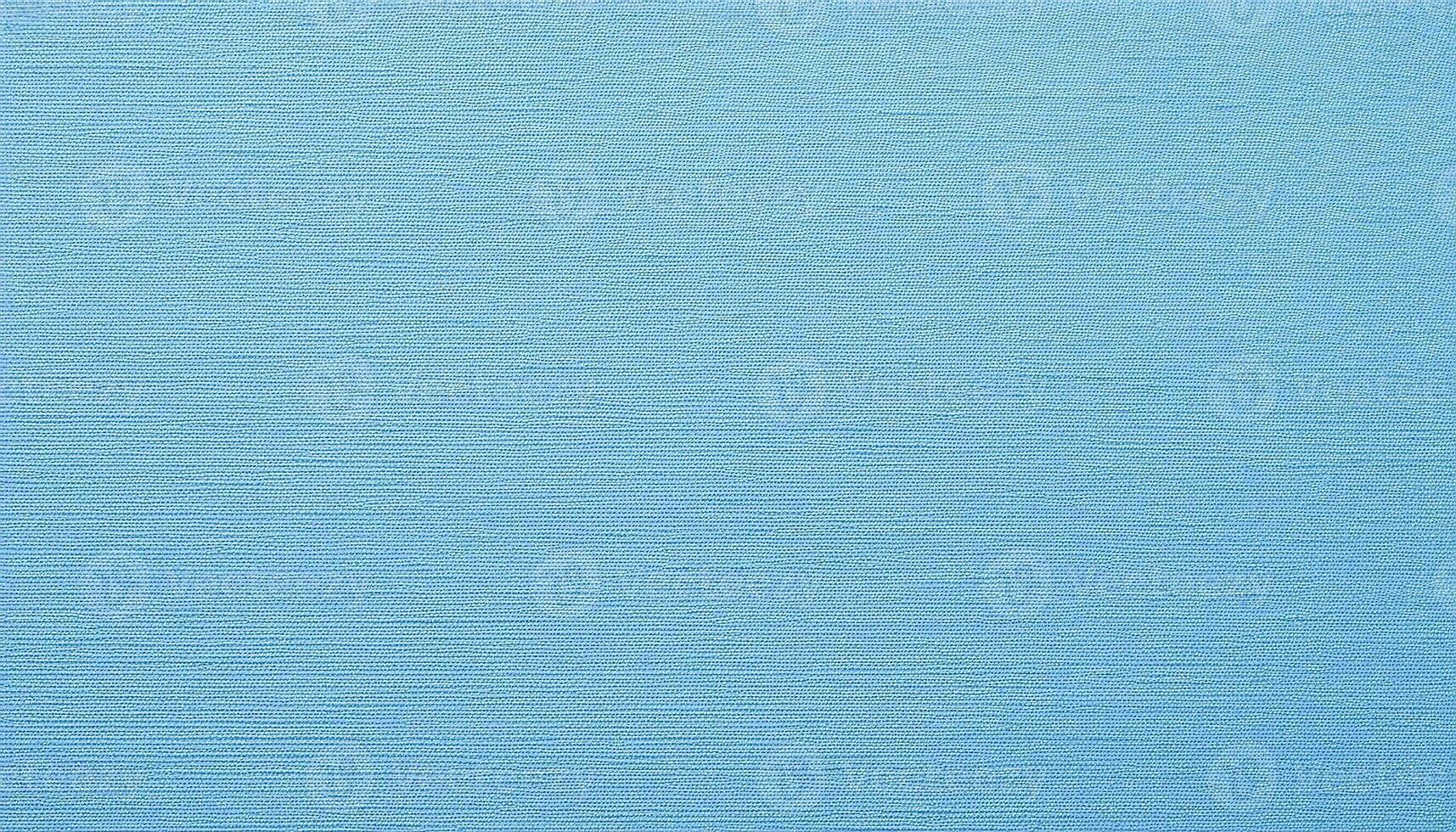 close-up of pale blue paper with subtle embossed linen texture for design and crafting projects photo