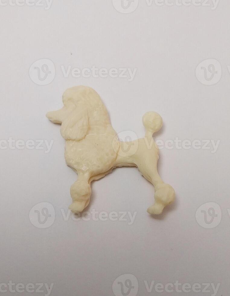 miniature cute handmade clay isolated sculpture white dog poodle photo