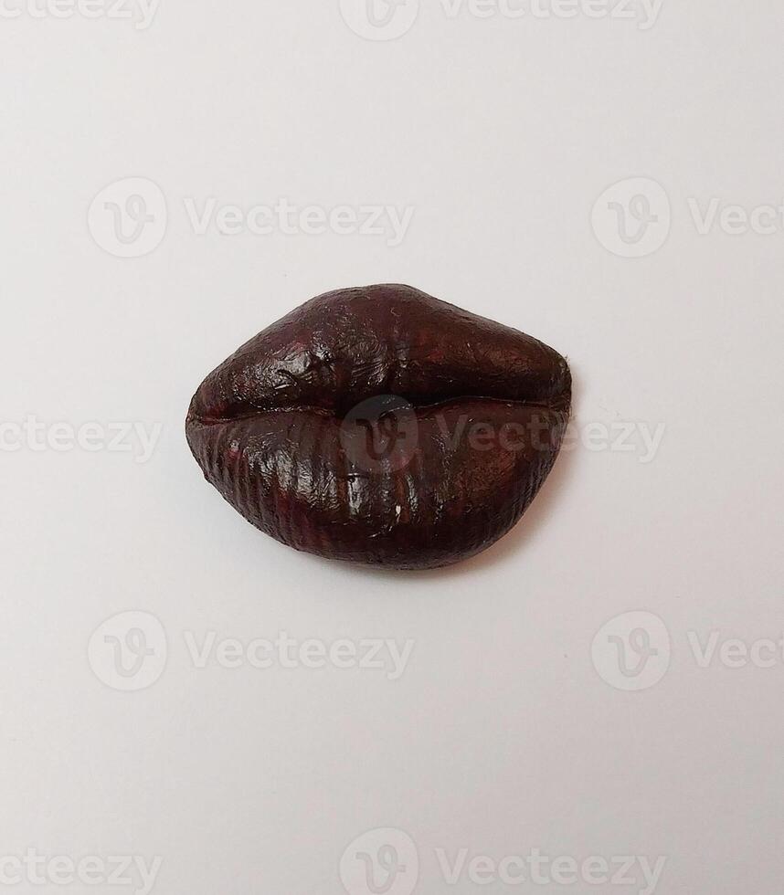 miniature cute handmade clay isolated sculpture mouth kiss lip color photo