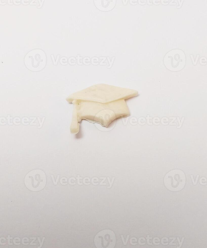 small cap miniature cute handmade clay isolated sculpture white graduate education photo