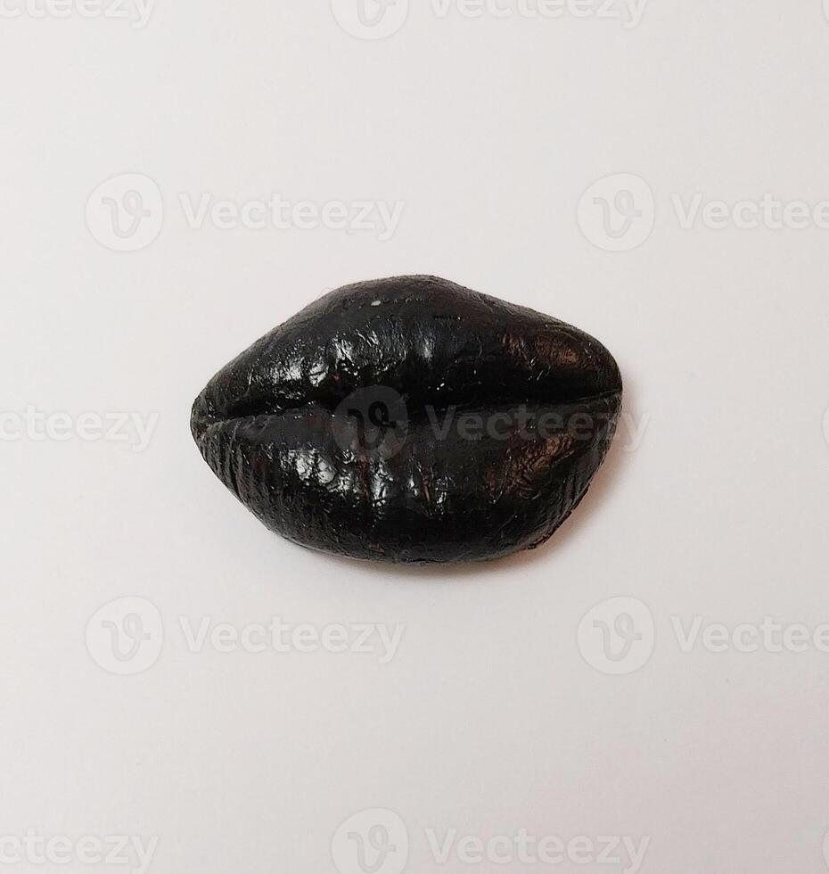 black miniature cute handmade clay isolated sculpture mouth kiss lip color photo