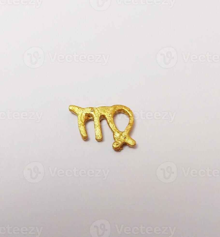 miniature cute clay isolated decorate zodiac sign gold virgo photo