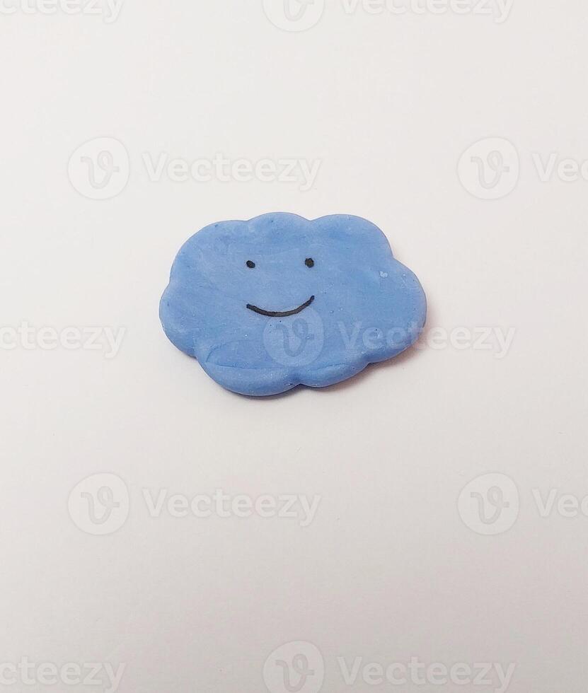 miniature cute handmade clay isolated sculpture cloud fog blue sky photo