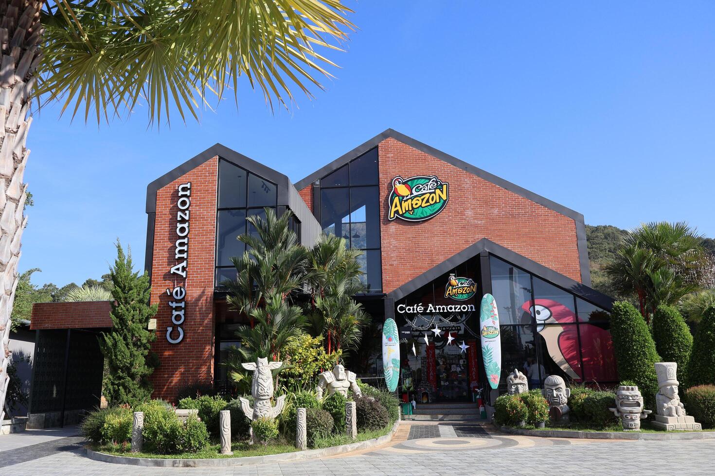 Rayong, Thailand. January 02, 2025 Beautiful cafe Amazon in gas station ptt background with sky and tree, mountain background photo
