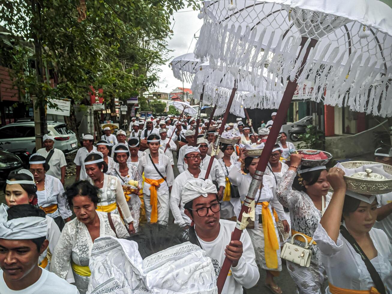 Bali - July 4, 2024. Ngangget Don Bingin is one of the sequences in the Memukur ceremony, an important ritual in Balinese tradition aimed at honoring and praying for the ancestral spirits photo