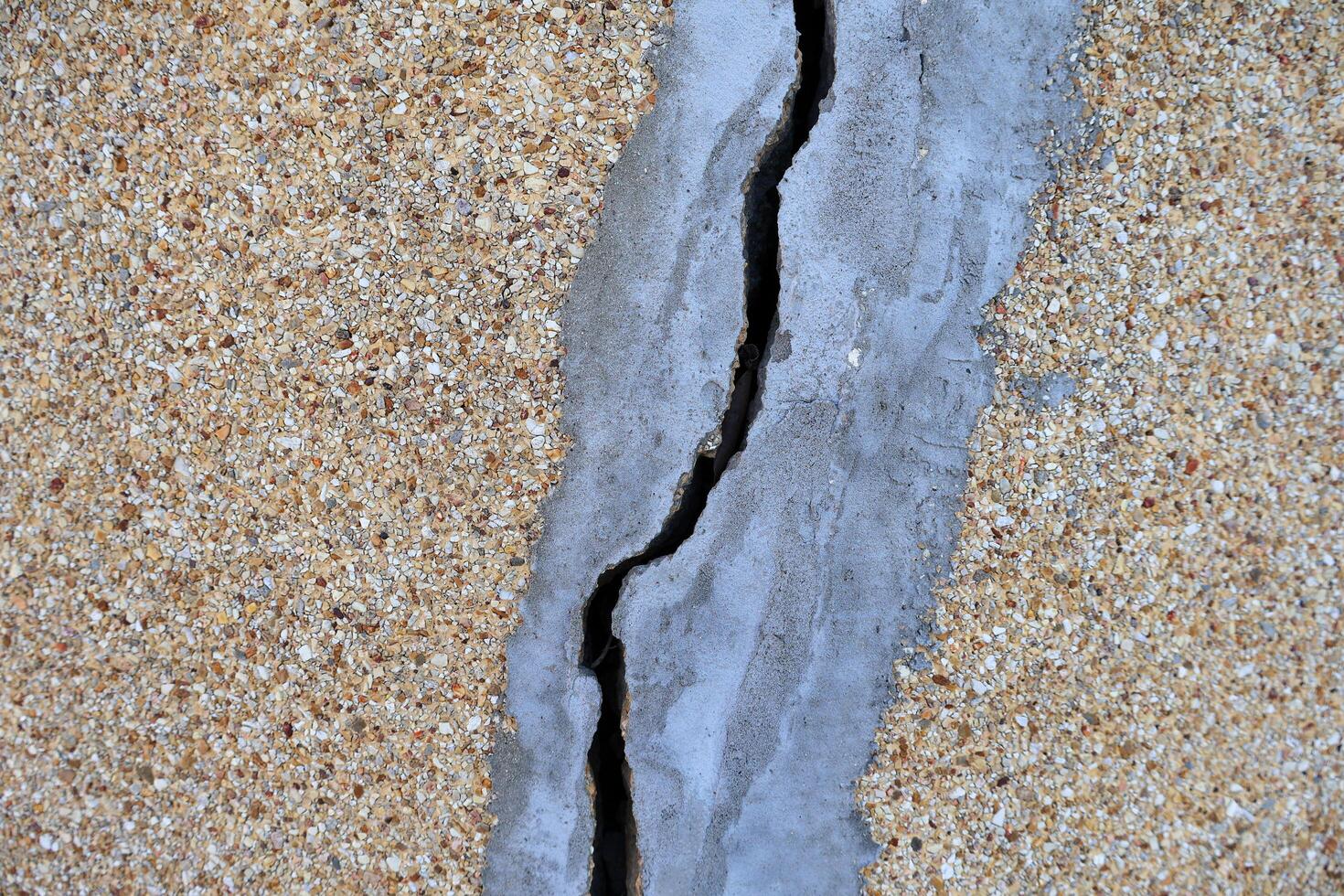 Cracked concrete wall texture at the outside cement that effected with earthquake photo