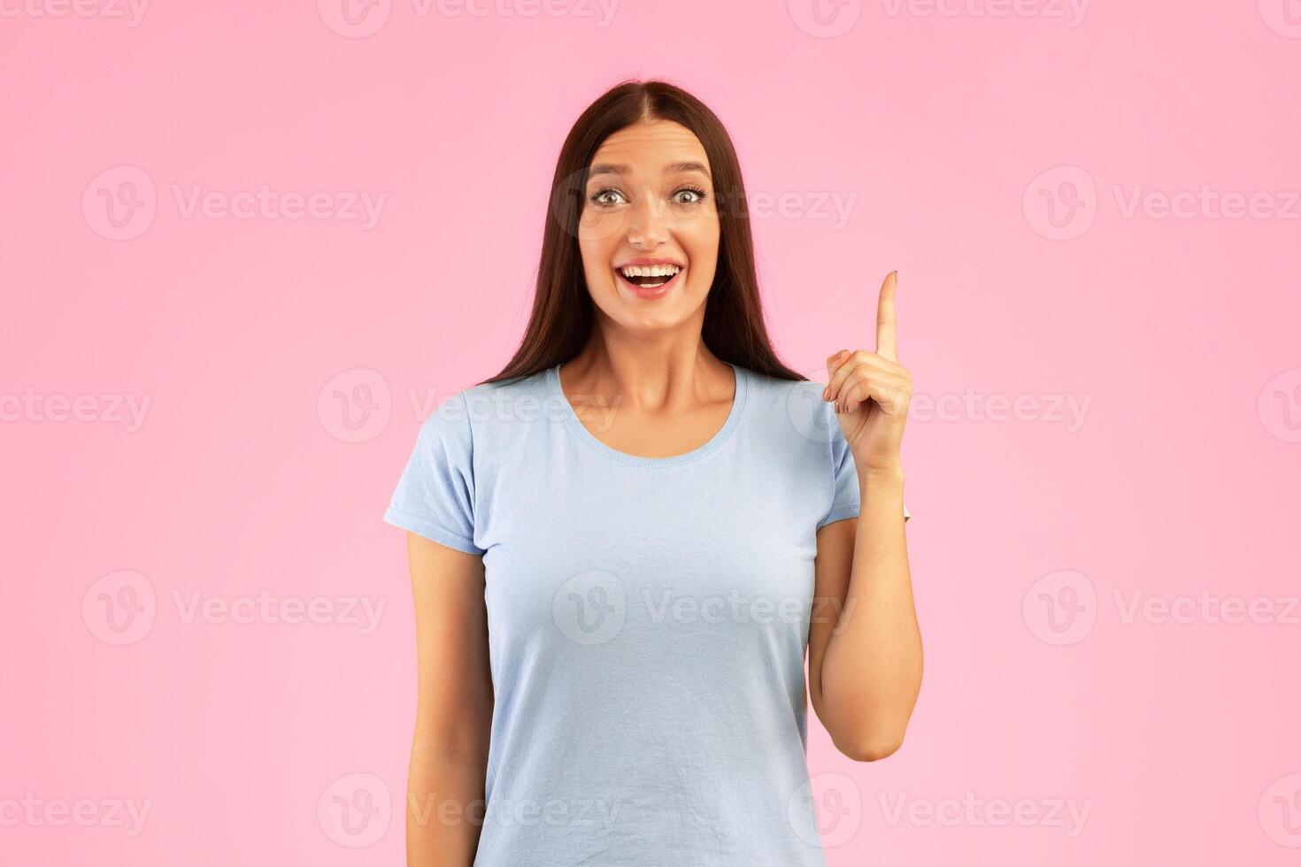 Great Idea Concept. Young Funny Woman Pointing Finger Up. Excited Lady Knows Answer, Got Solution To Problem, Having Aha Moment Or Inspiration, Isolated On Yellow Studio Background. Wow, Eureka photo