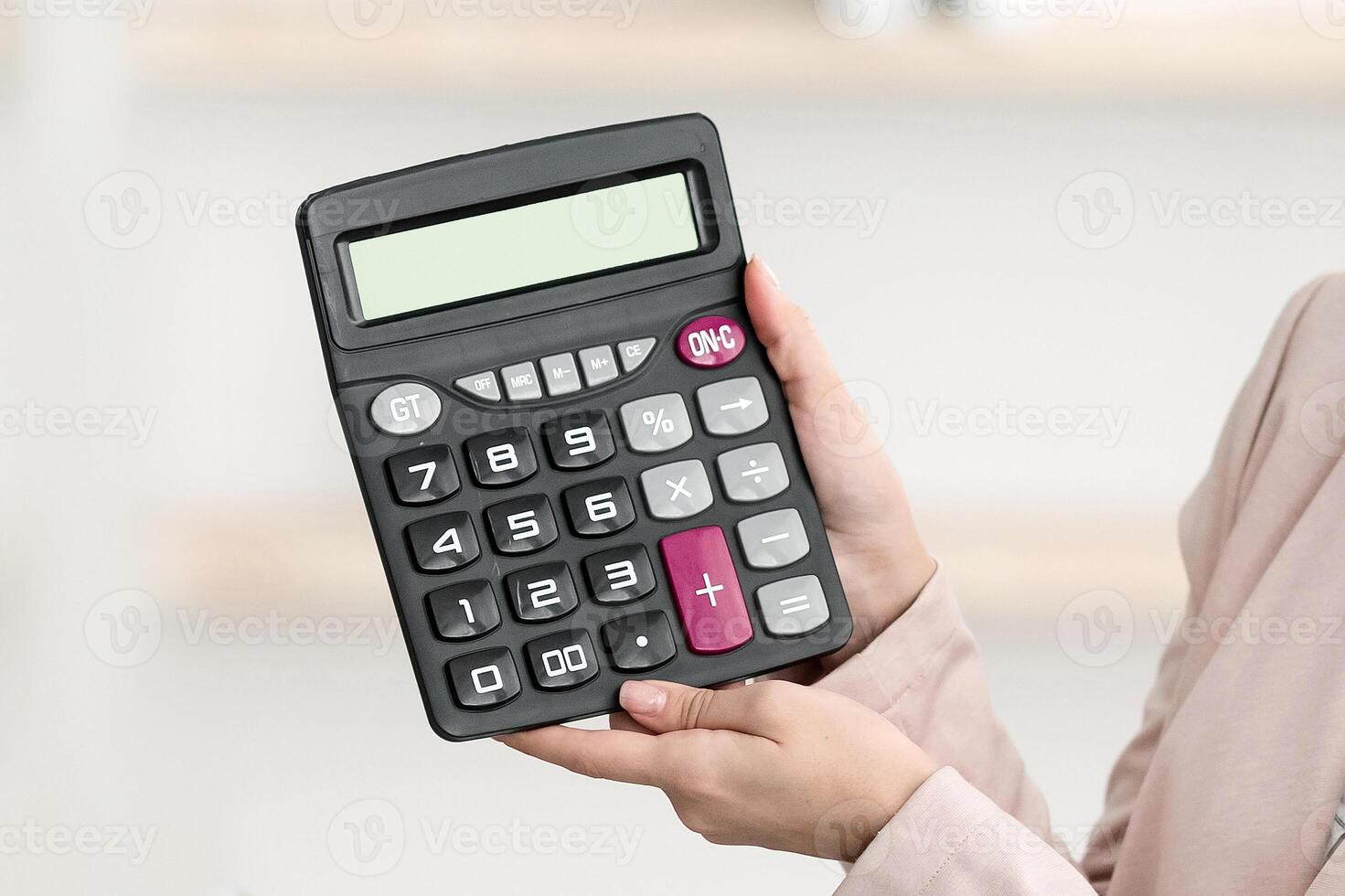 Tour Agent Lady Showing Calculator With Price To Black Family Couple Offering Expensive Vacation Trip Sitting In Travel Agency Office, Wearing Face Masks. Selective Focus photo
