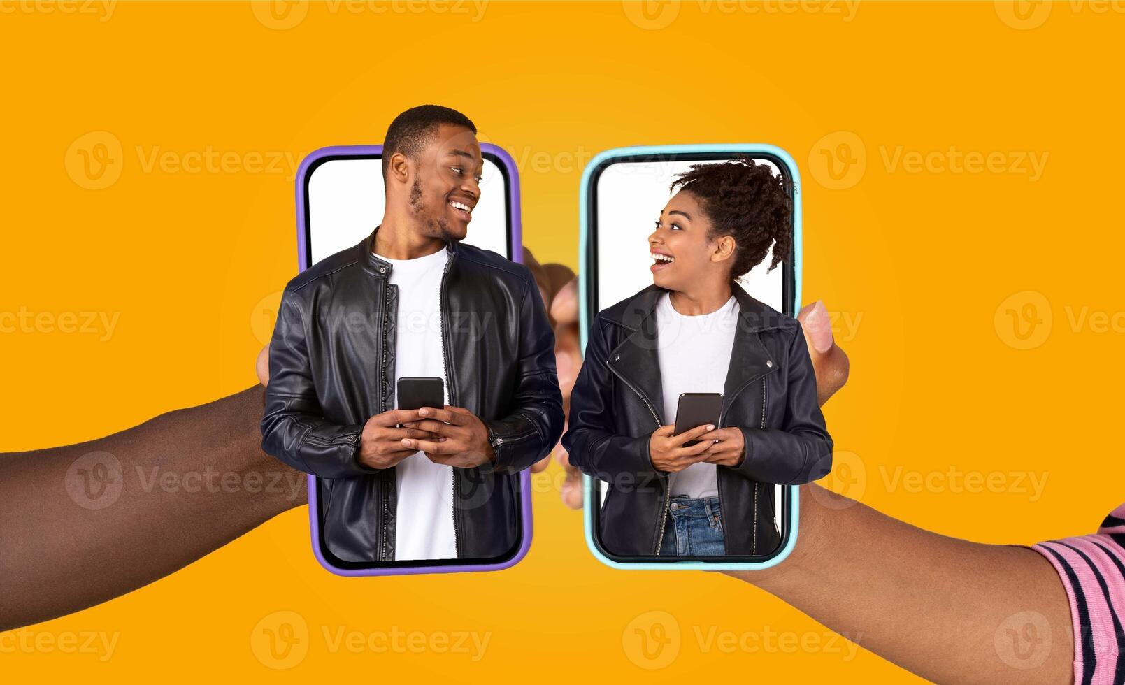African American married couple shares a joyful moment while chatting on their smartphones. They engage with each other using a fun application, showing love and affection in their daily lifestyle. photo