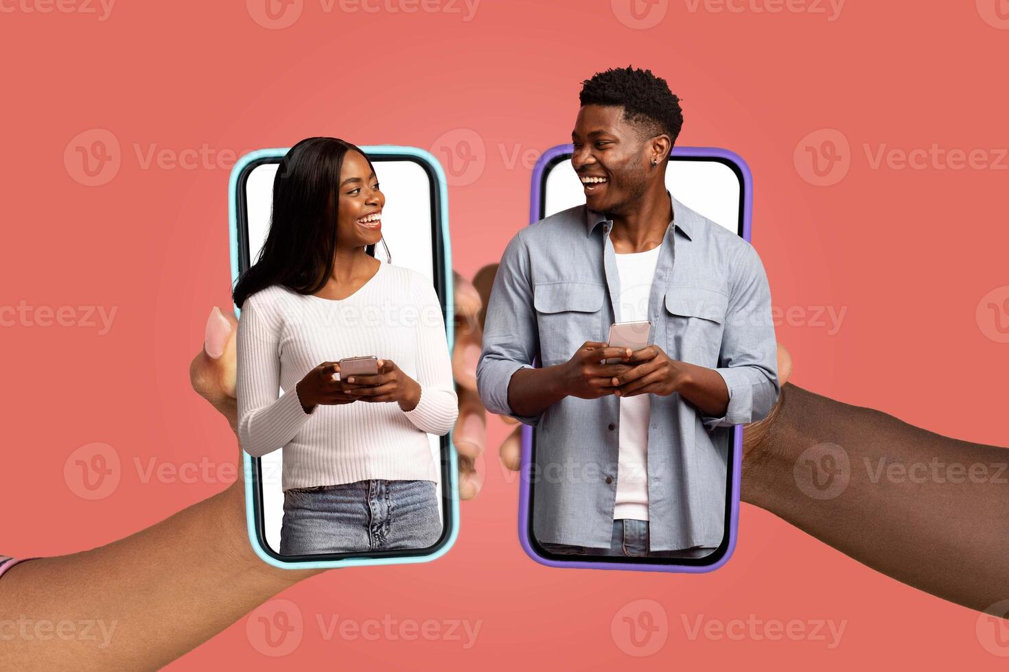 A married African American couple engages in an affectionate exchange via their smartphones while smiling at each other. This moment highlights intimacy in a modern, tech-savvy lifestyle. photo