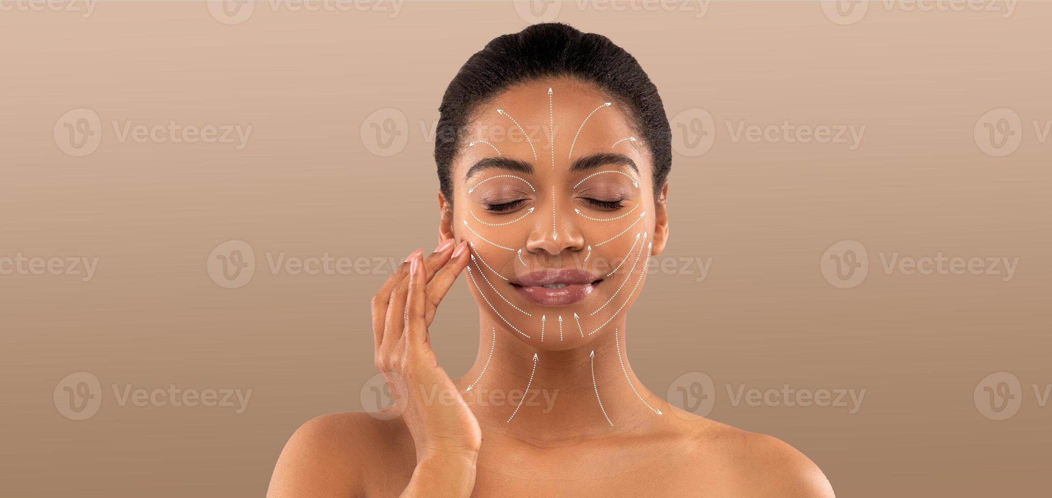 A woman indulges in a skincare routine, applying a facial treatment while enjoying a moment of self-care. Her serene expression highlights the importance of beauty and relaxation. photo