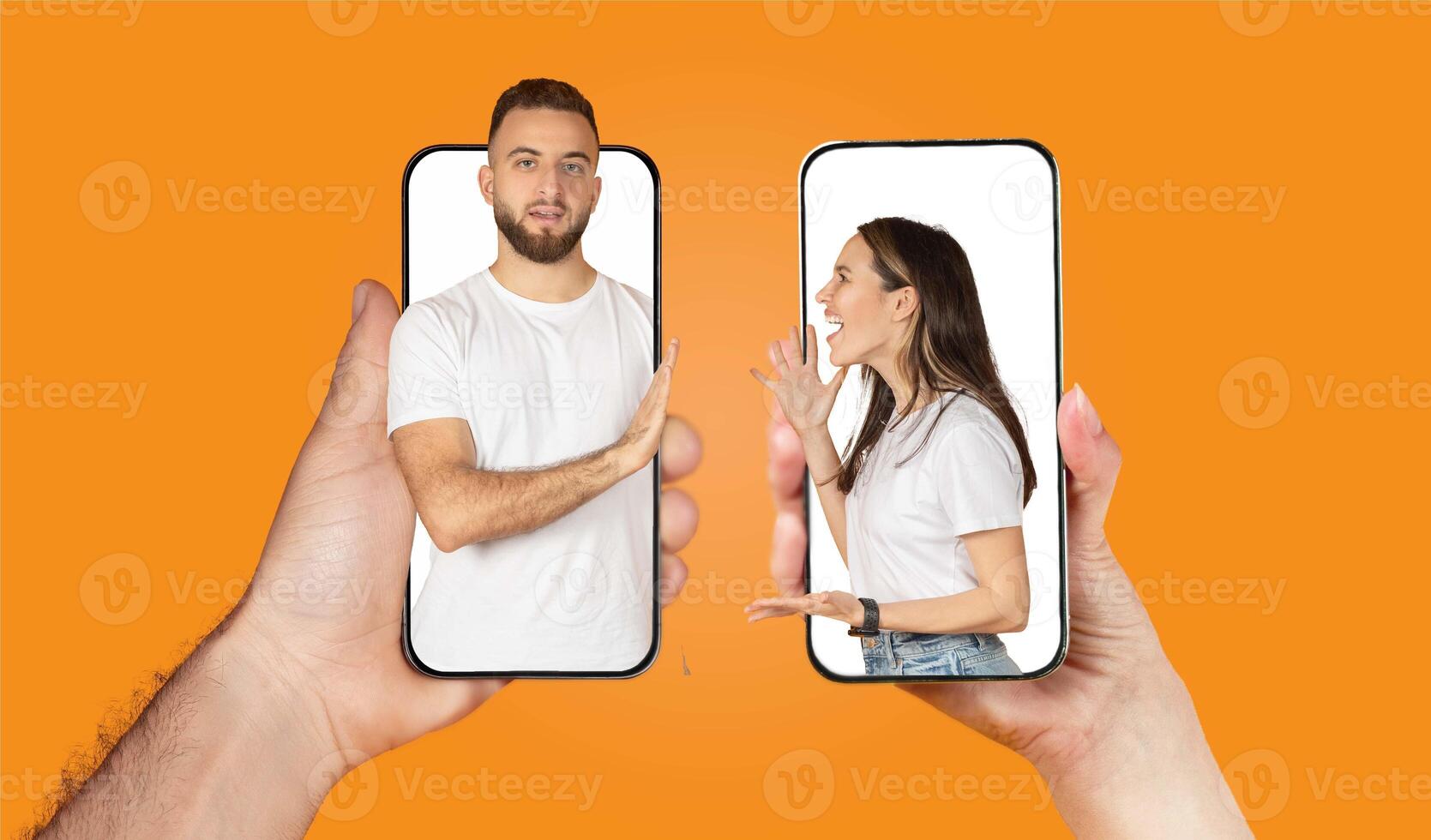 A couple interacts through their smartphones, showcasing the modern way of staying connected. Their expressions reflect the love and affection they share, even while apart. photo