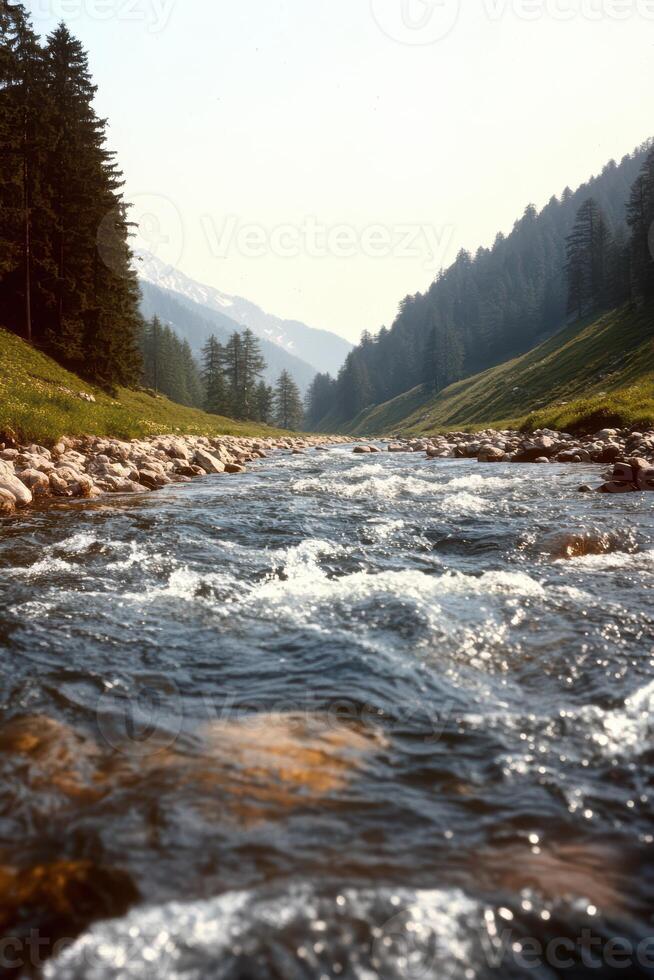 A river with a rocky bed and a mountain in the background photo