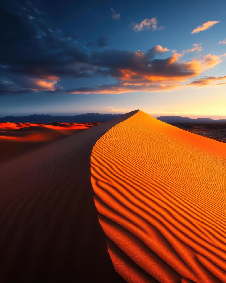 A desert scene with a sand dune and a cloudy sky photo