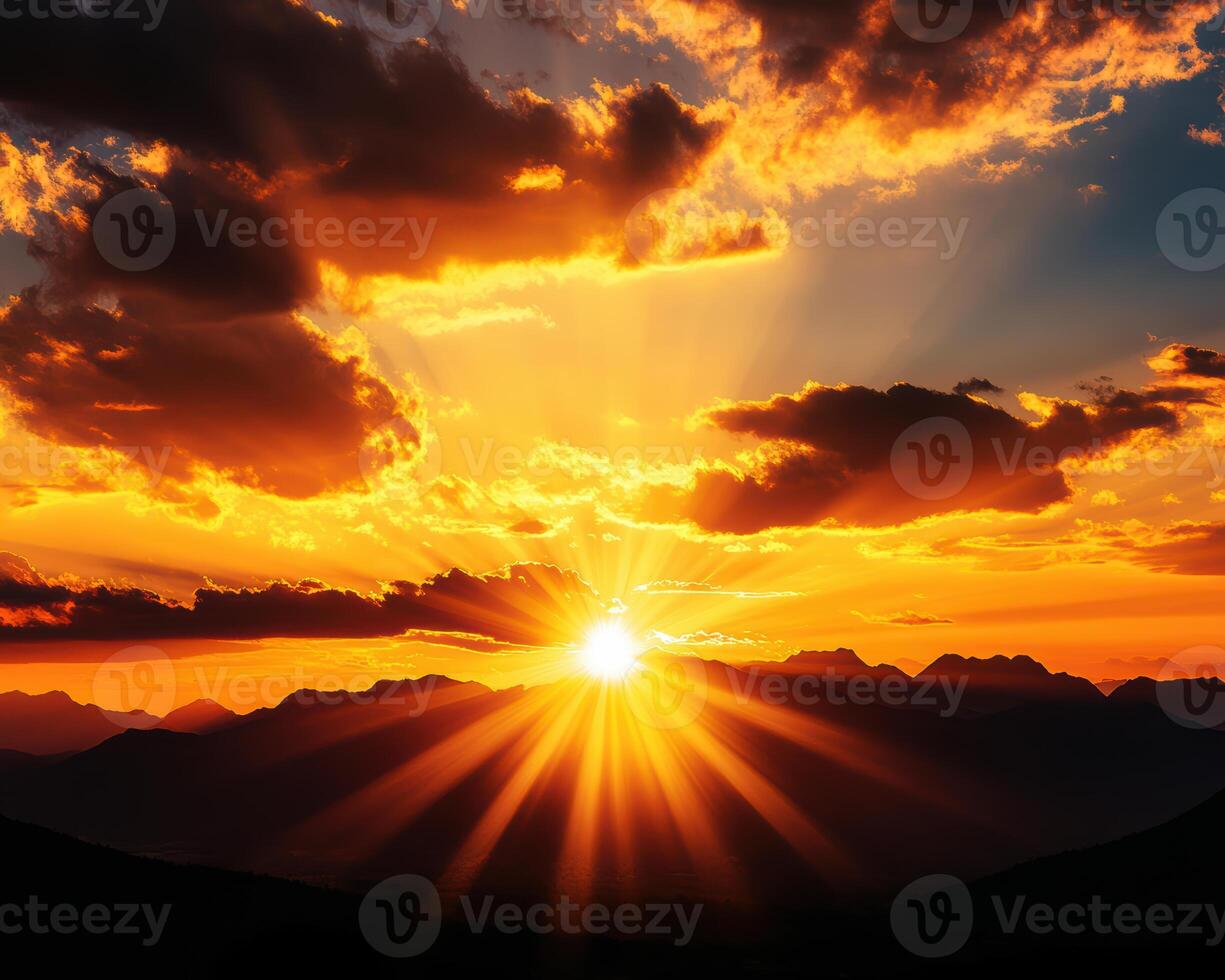 The sun is setting over a mountain range, casting a warm glow over the landscape photo