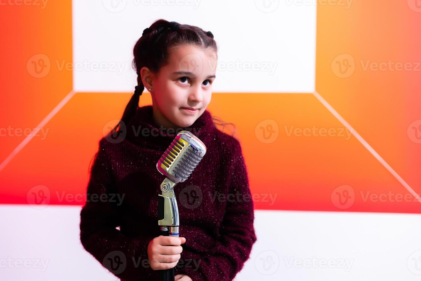 pretty little girl with the microphone in her hand photo