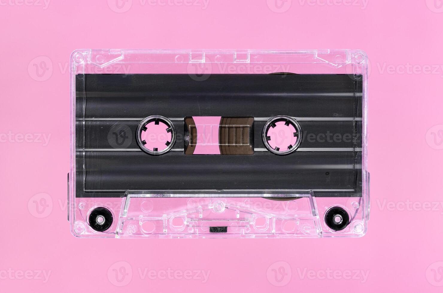 Blank Vintage audio cassette isolated on pink background. Template mock up photo
