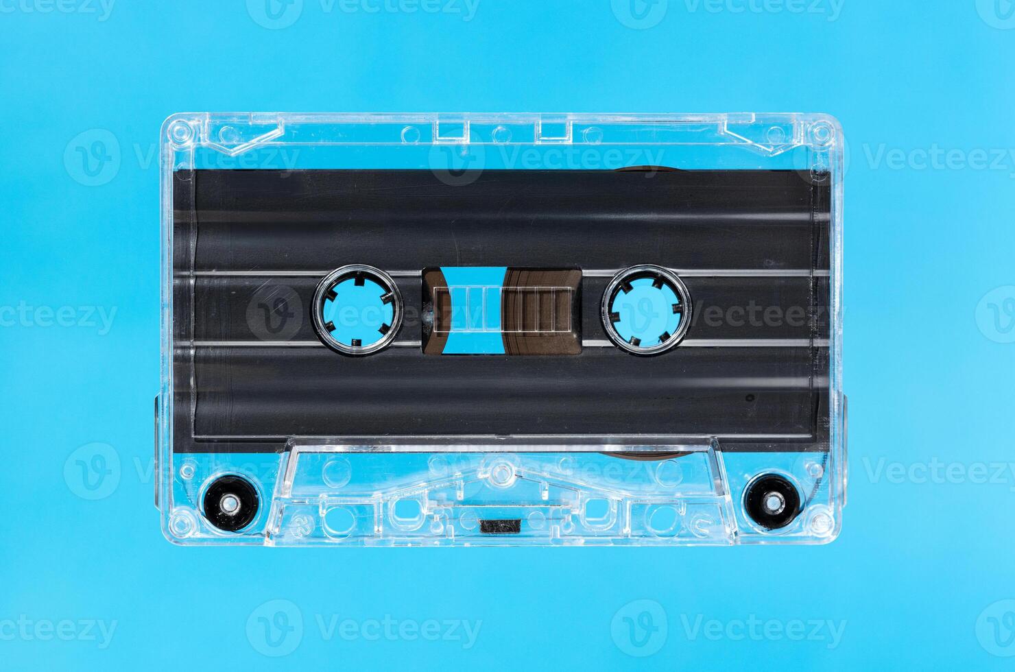 Blank audio cassette isolated on blue background. Template mock up photo