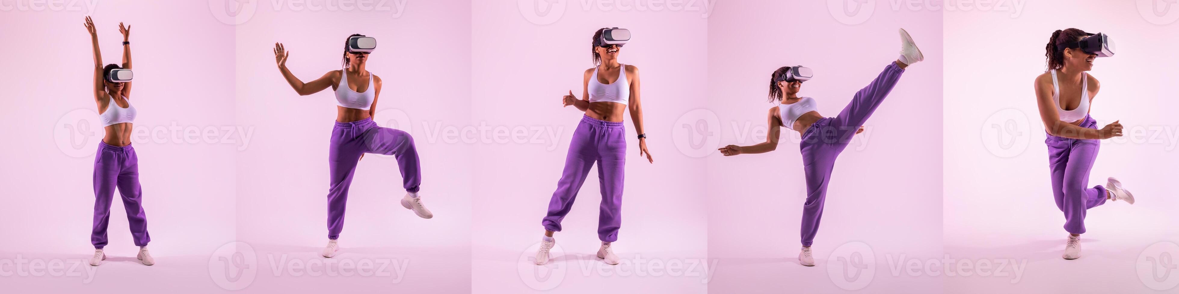 A young woman wearing virtual reality goggles dances energetically in a colorful studio. She showcases various movements, combining fitness and gaming in a fun environment. photo