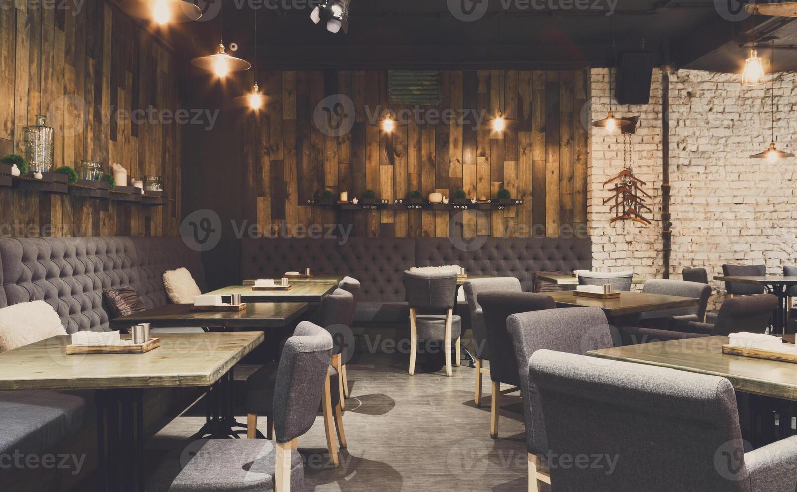 Cozy wooden interior of restaurant, copy space. Comfortable modern dining place, contemporary design background photo