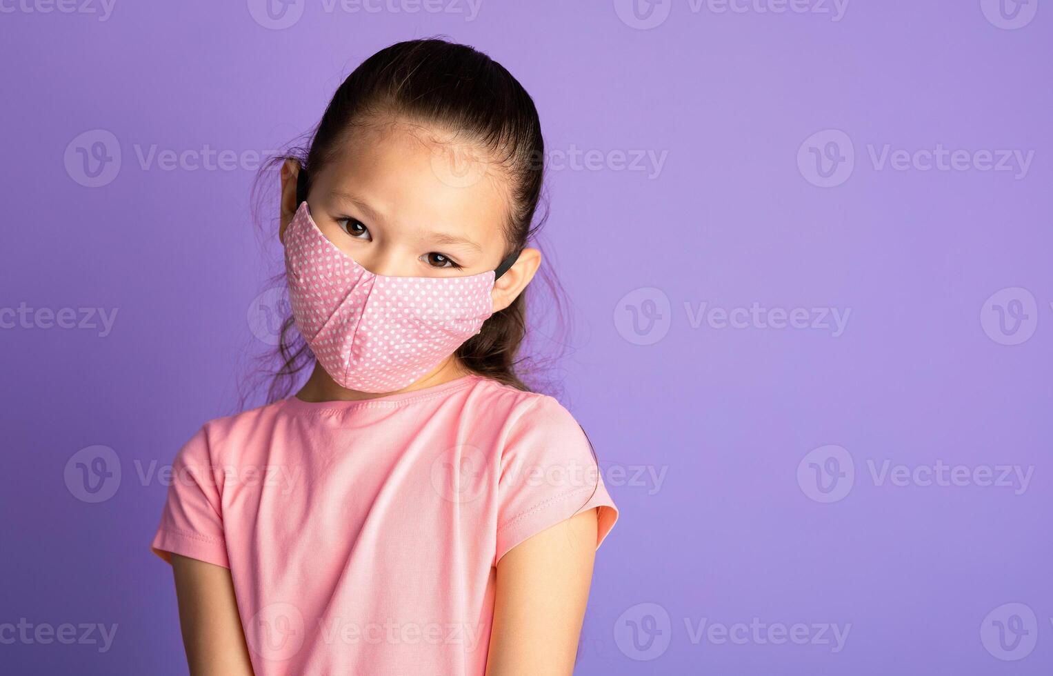 Protection Against Disease. Asian kid wearing home made hygienic face mask to prevent infection, illness, flu or 2019-nCoV photo