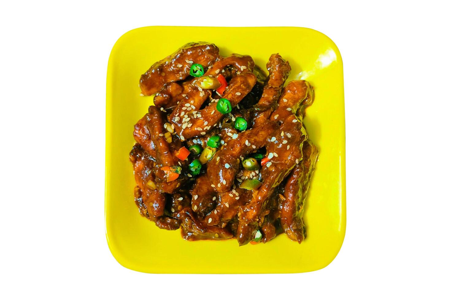 Spicy Korean chicken dish. Deep fried chicken with chili, and sour sauce in Korean style. sweet and spicy taste. Asian food concept. Selective Focus. Isolated photo