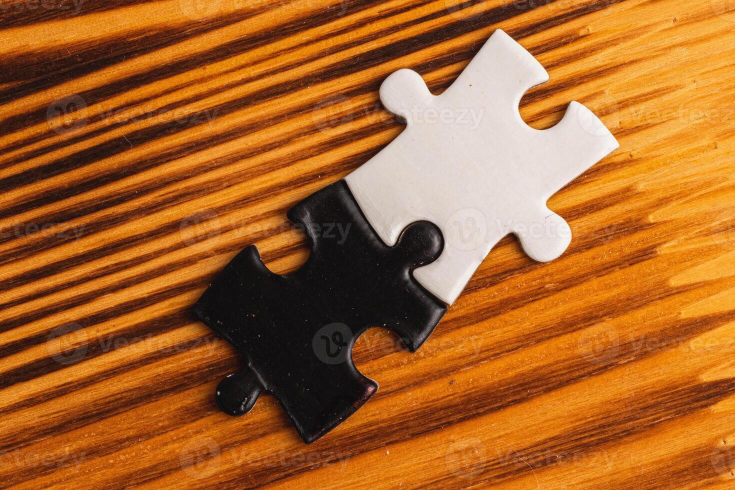puzzle pieces, black and white, concept of unity between opposites photo