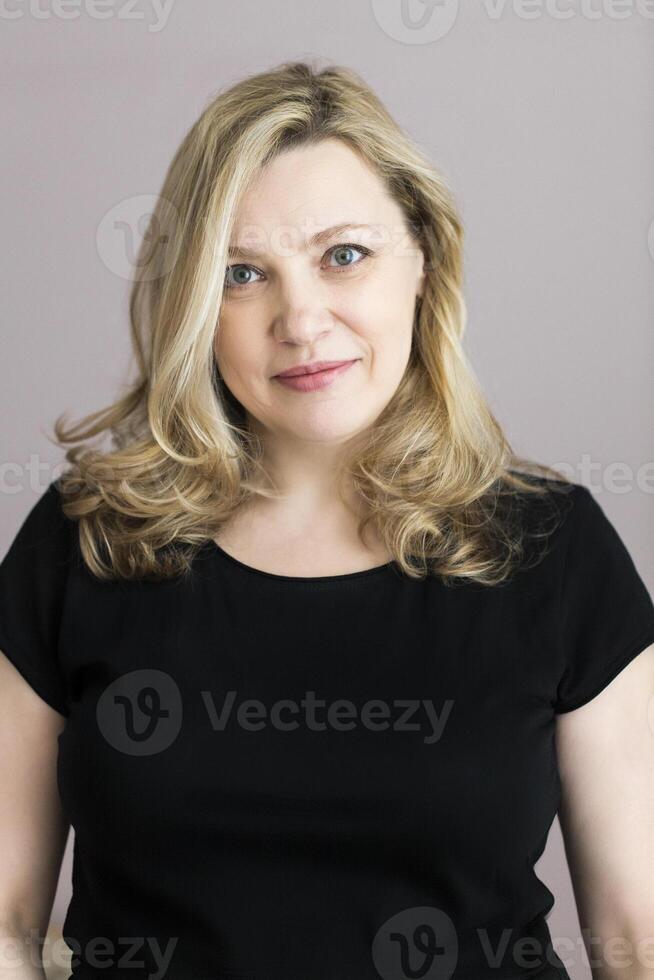Portrait of a middle age woman in the room photo