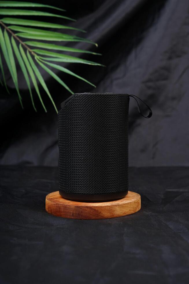 Bluetooth Speaker. Wireless portable with surround stereo sound on black background. photo