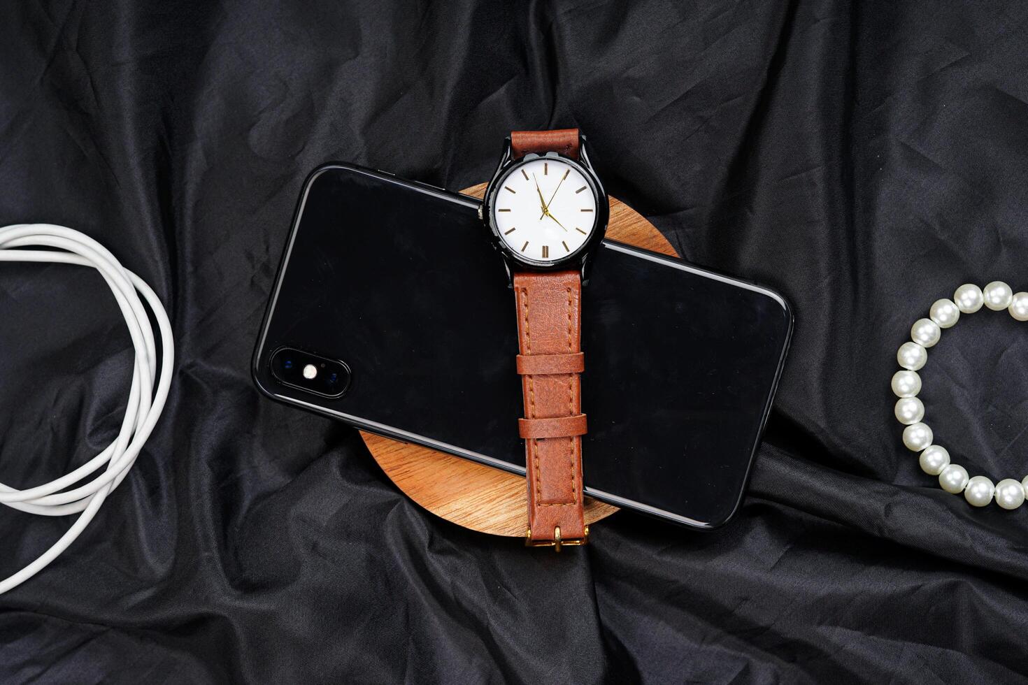 Smartphone top view luxury watch isolated on black background. High resolution photo. photo
