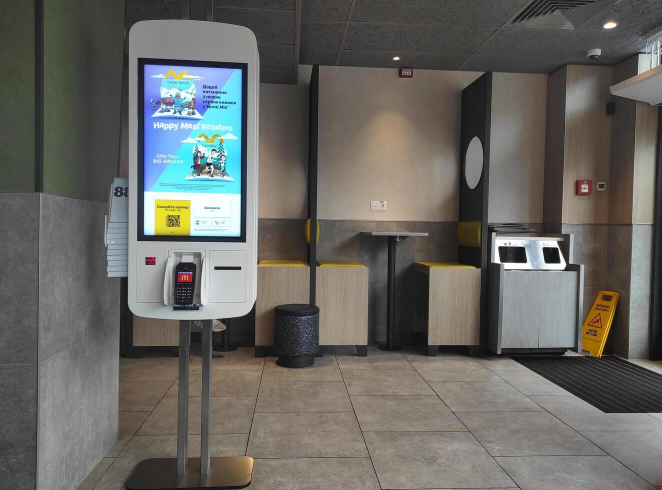 Kyiv, Ukraine - October 30, 2024. McDonald's self-order kiosks. Convenient quick order. Menu with prices and information on the screen. Self-service. Fast food. Cashless payments. photo