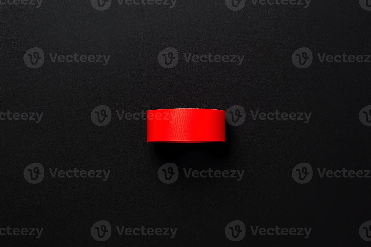 A red band on a black surface photo
