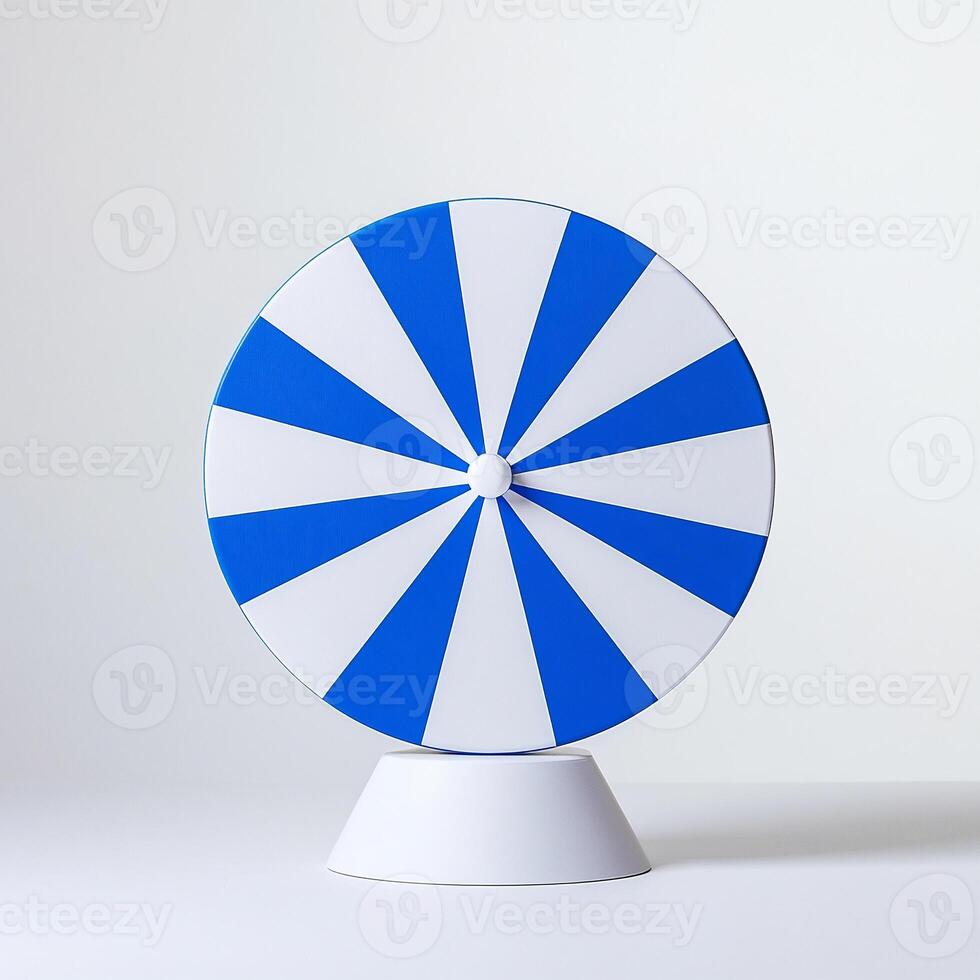 A blue and white spinning wheel on a white surface photo