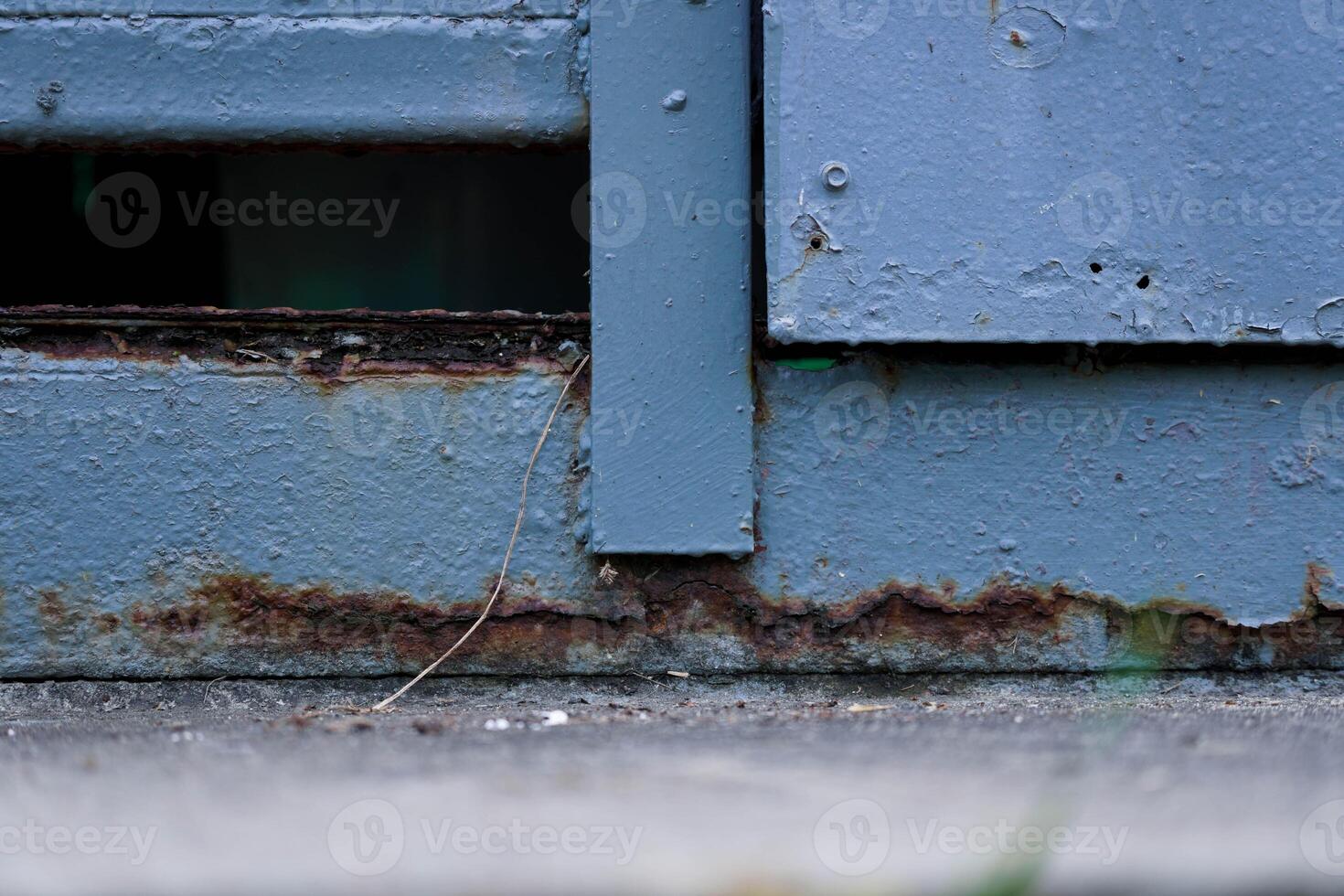 Close-up of a rusty iron door. Metal rust. Metal corrosion. Rust and corrosion on old iron. photo