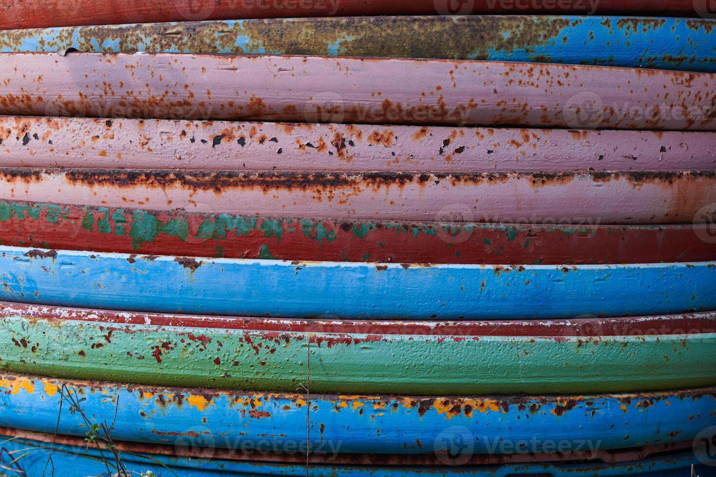 Close-up of a rusty iron fence. Metal rust. Metal corrosion. Rust and corrosion on old iron. photo